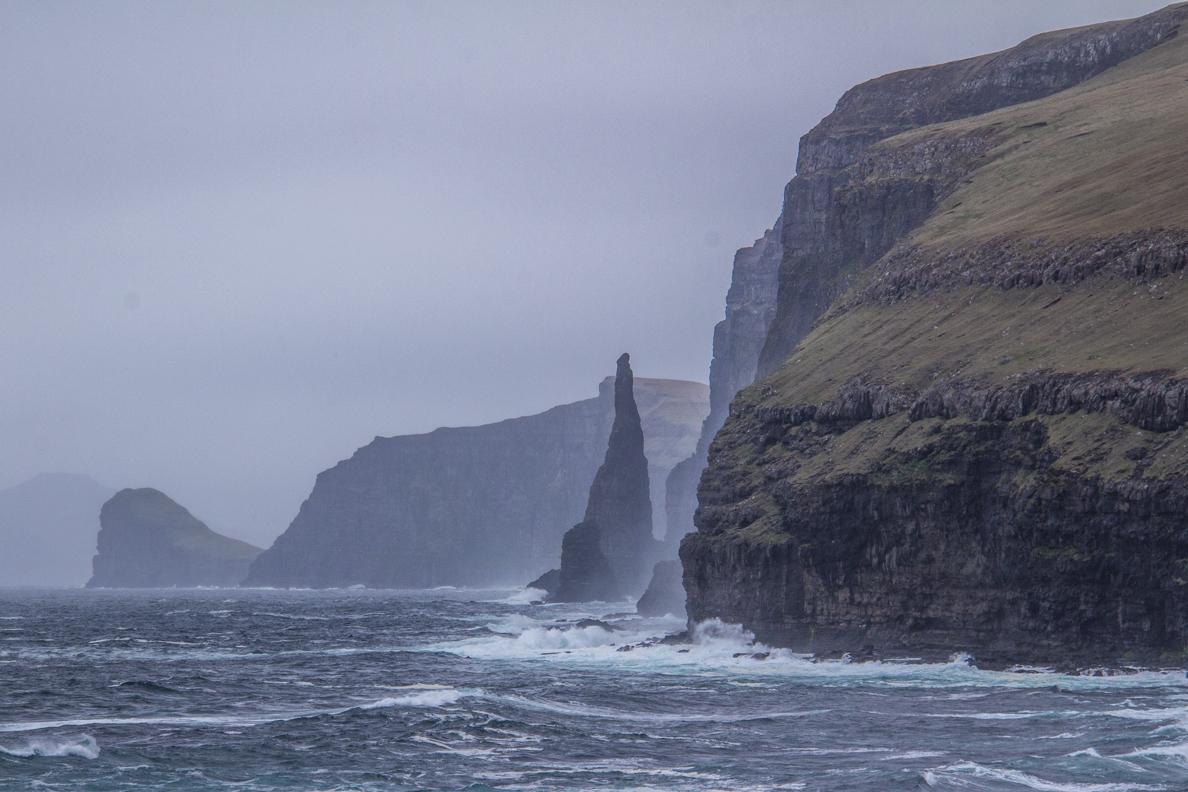 Oknadalsdrangur sea stack on Sandoy an island in the Faroe Islands 7639