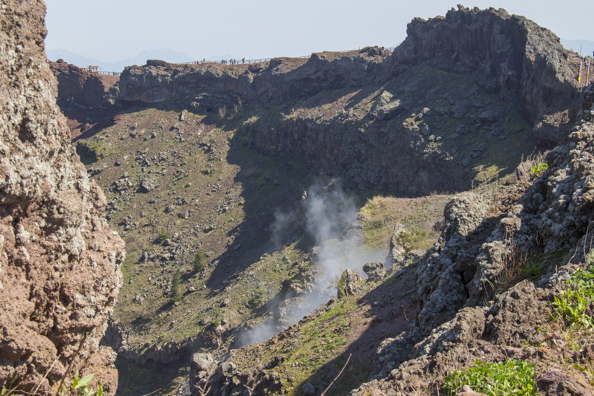 A fumerole smoking inside the crater of Mount Vesuvius in Italy
