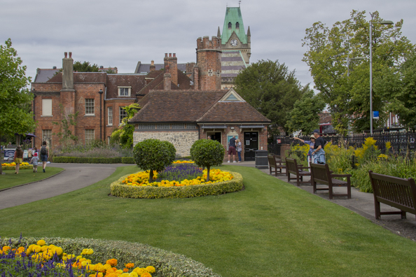 Abbey Gardens with the clock on the Guild Hall of  Winchester in the background-