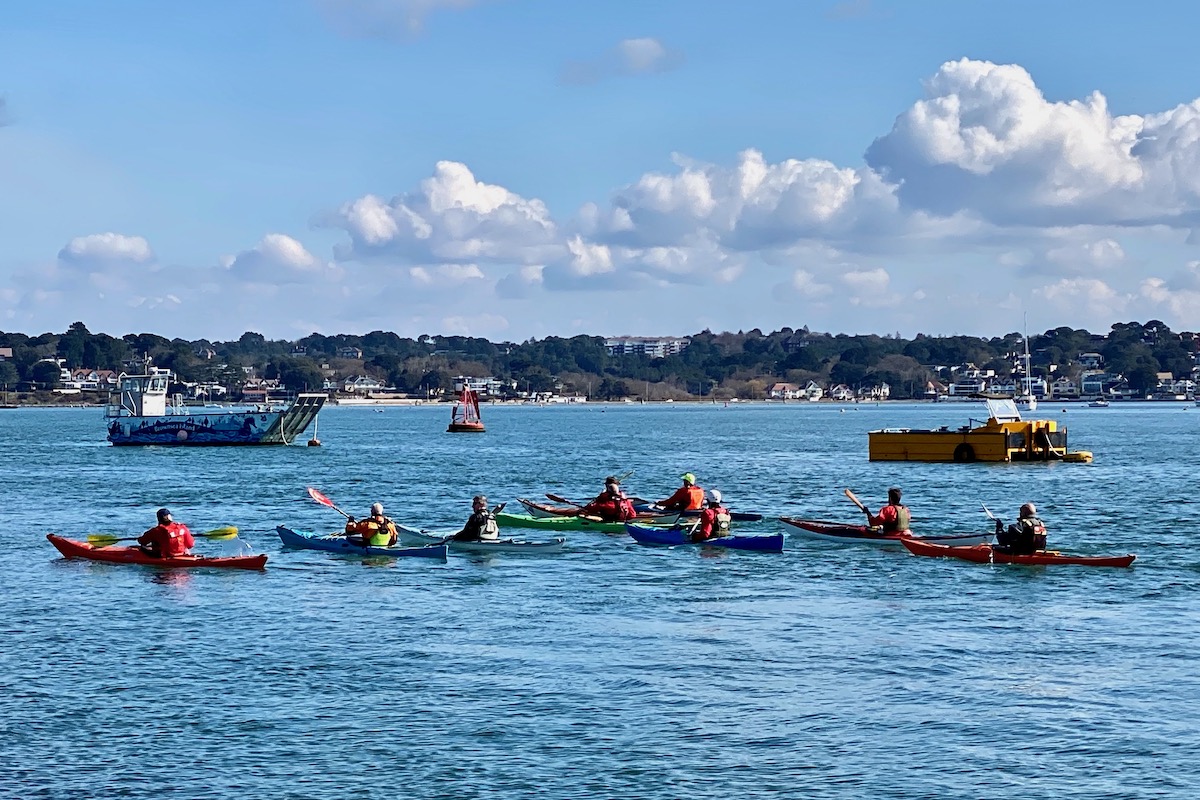 A Flotilla of Canoes Passing Brownsea Island in Dorset