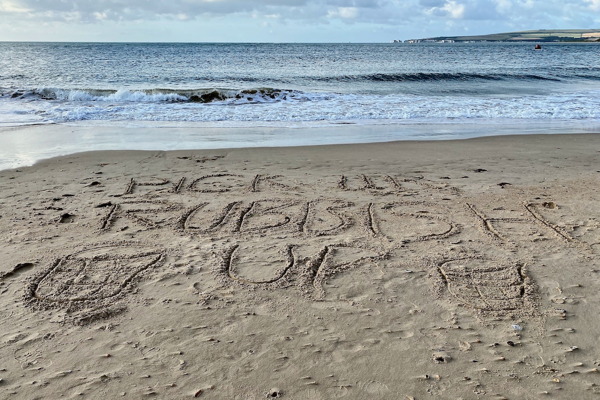 A Message to Visitors on Sandbanks Beach