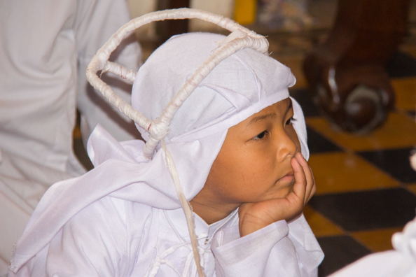 A young member of the Cao Dai Temple at Tay Ninh in Vietnam
