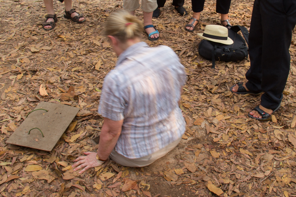 Attempting to enter a tunnel in the complex at Cu Chi in Vietnam