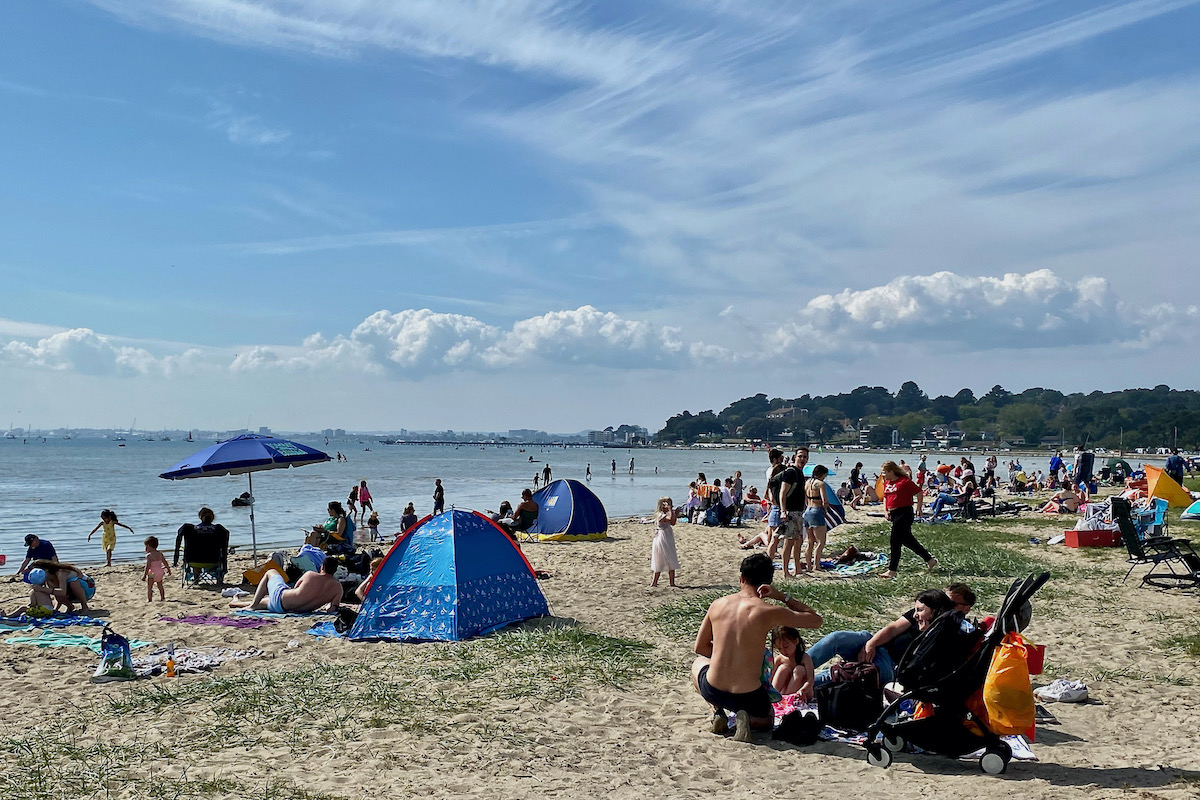 Bank Holiday Sunday on Kite Beach by Poole Harbour in Dorset