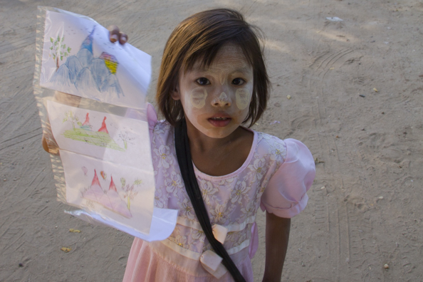 Children selling drawings in Bagan Myanmar