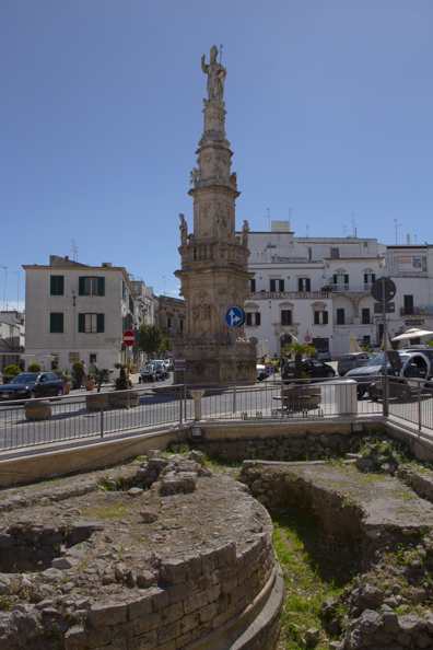 Column of Sant'Oronzo in front of the excavations in Piazza della Libertà in Ostuni, Puglia, Italy