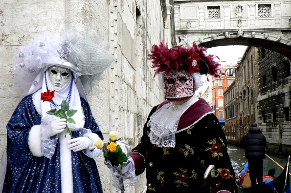 Masqueraders in front of the Bridge of Sighs in Venice