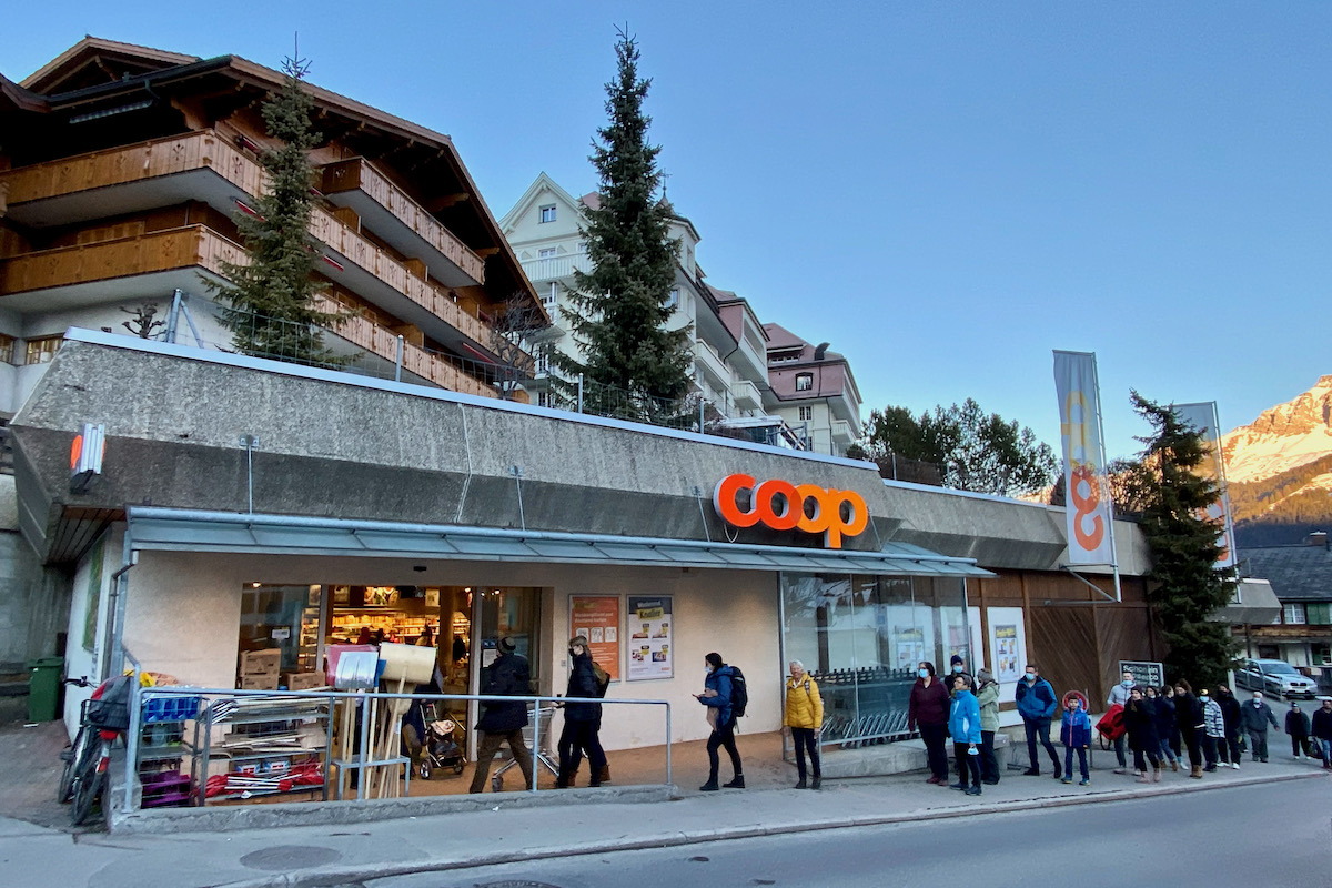 COVID Queue Outside the Co Op in Adelboden, Switzerland