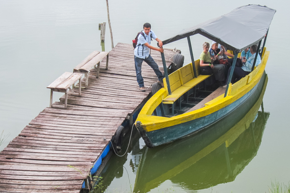 Roel shepherds us on to the boat to cross the lake betweenYaxhá and Topoxté in Guatemala