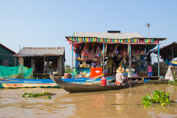 Doing the weekly shop in Chong Khneas a floating village on Tonle Sap Lake,  Cambodia