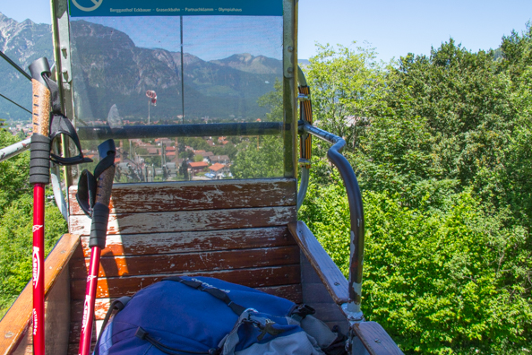 Eckbauerbahn cable car rising above Garmisch-Partenkirchen in Bavaria