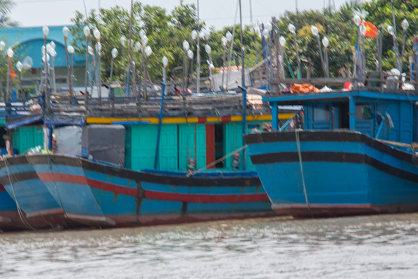 Fishing boats moored on the Tien Gang River in Vietnam