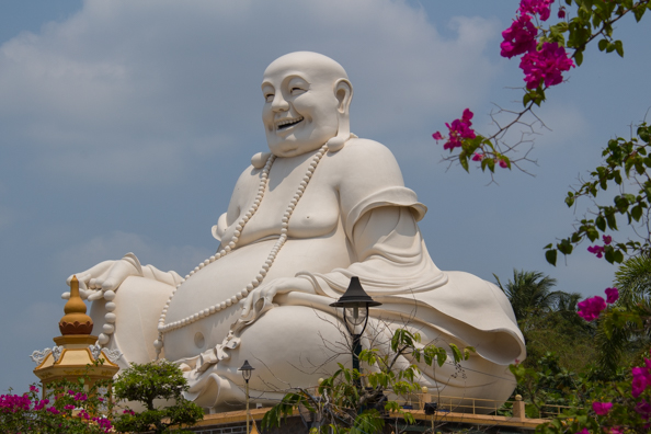 Giant laughing Buddha at Vinh Trang Pagoda, My Tho, Vietnam