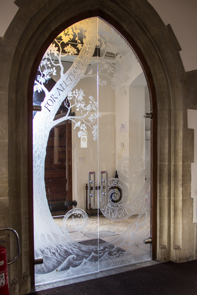 Glass door inside the Church of St Thomas in Lymington, New Forest, Hampshire, UK