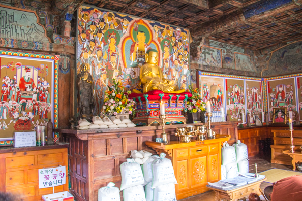 Inside the Main Hall Amitabha or  Infinite Light sits alone on the altar at Tongdosa temple South Korea