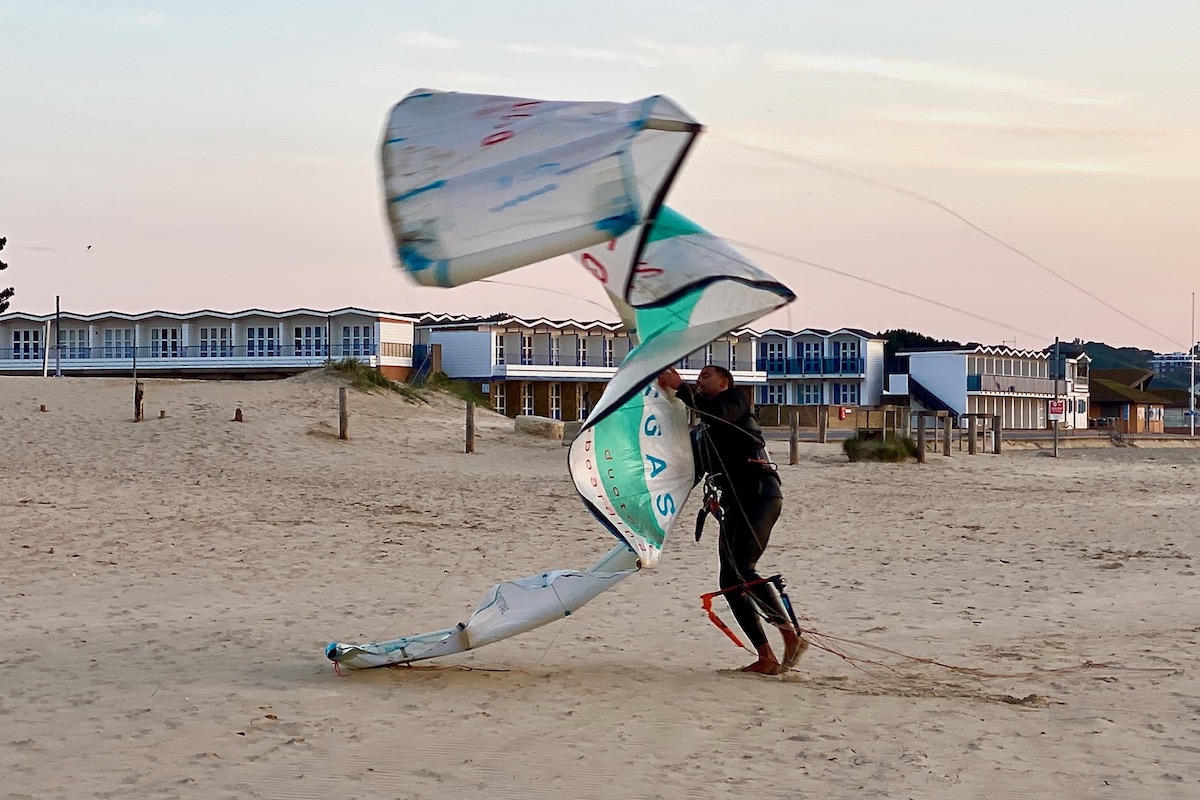 Kite Boarder Tussles with the Wind on Sandbanks Beach in Dorset
