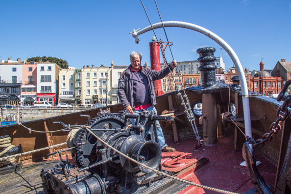 Michael on the steam tug Cervia in the Royal Harbour at Ramsgate, Thanet, Kent
