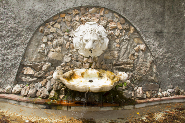 Old drinking fountain in the Orto Botanico Comunale di Lucca in Tuscany