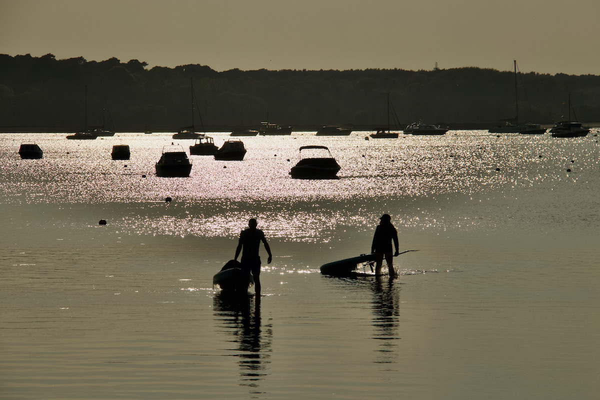 Paddle Boarders Run out of Water in Poole Harbour, Dorset