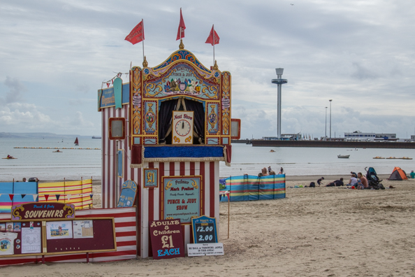 Punch and Judy on the beach at Weymouth, Dorset, UK