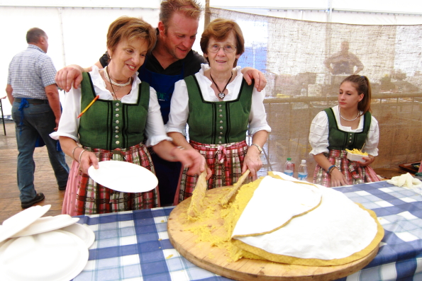 Serving polenta at a large gathering in Pinzolo