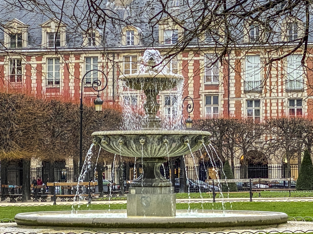 Square Louis XIII in Place des Vosges in the Marais a district of Paris
