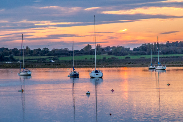 Sun setting over the River Alde in Aldeburgh, Suffolk