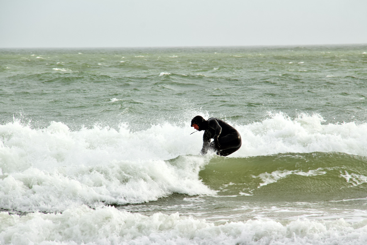 Surfer off Sandbanks Beach in Dorset