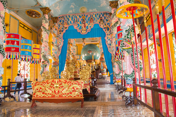 The elaborate interior of the Cao Dai Temple at Tay Ninh in Vietnam