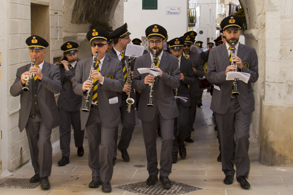 The local band parades through the old town of  Monopoli in Puglia, Italy -9996