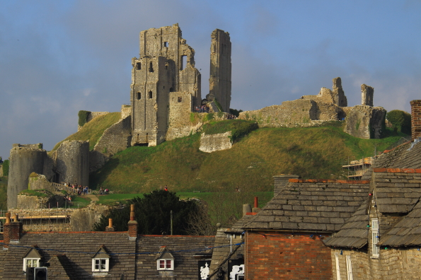 The ruins of Corfe Castle tower above the village of Corfe Castle in Dorset
