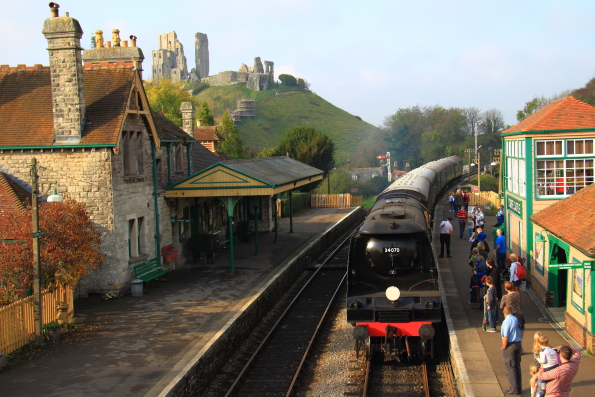 Steam train arriving at Corfe Castle Station