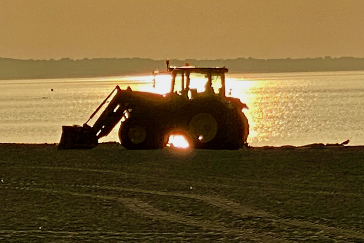 Tractor Working on Sandbanks Beach in Dorset