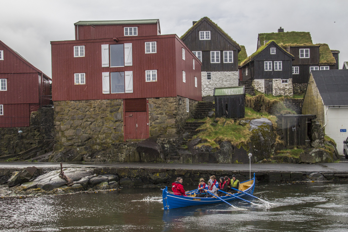 Traditional rowing boat going out to practice at Tórshavn capital of the Faroe Islands  7196
