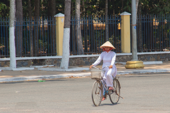 Worshipper arriving at the Cao Dai Temple at Tay Ninh in Vietnam