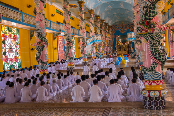 Worshipping in the Cao Dai Temple at Tay Ninh in Vietnam