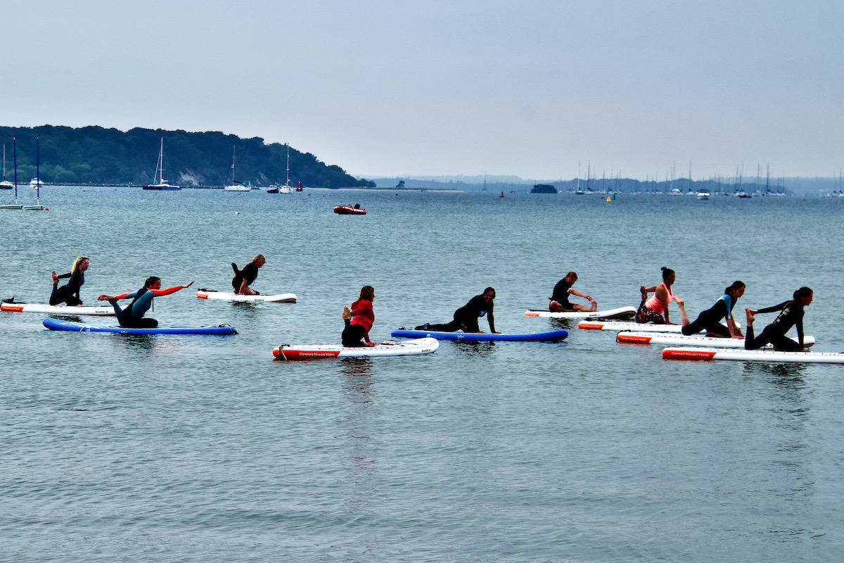 Yoga on Paddle Boards in Poole Harbour, Dorset